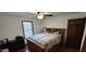 Bedroom featuring hardwood floors, natural lighting, ceiling fan, and traditional furniture at 543 Schooley Dr, Greenwood, IN 46142