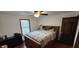 Cozy bedroom with hardwood floors, warm natural light, and a functional ceiling fan at 543 Schooley Dr, Greenwood, IN 46142