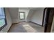Bright bedroom featuring neutral carpet and a window letting in plenty of natural light at 543 Schooley Dr, Greenwood, IN 46142