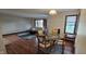 Dining room and living room featuring hardwood floors and a modern table set at 543 Schooley Dr, Greenwood, IN 46142