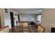Dining room and living room featuring hardwood floors and a modern table set at 543 Schooley Dr, Greenwood, IN 46142
