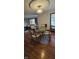 Dining room and living room featuring hardwood floors and a modern table set at 543 Schooley Dr, Greenwood, IN 46142