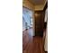 Hallway with hardwood floors, light walls, and stairs at 543 Schooley Dr, Greenwood, IN 46142