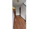 Hallway with hardwood floors, light walls, and doors leading to other rooms or closets at 543 Schooley Dr, Greenwood, IN 46142