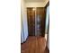 Hallway with hardwood floors, light walls, and doors leading to other rooms or closets at 543 Schooley Dr, Greenwood, IN 46142