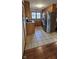 Efficient kitchen with stainless steel refrigerator, granite countertops, and tile flooring at 543 Schooley Dr, Greenwood, IN 46142