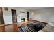 Inviting living room with a cozy fireplace, built-in bookshelves, and hardwood floors at 543 Schooley Dr, Greenwood, IN 46142