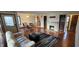 Open living space with hardwood floors, fireplace, and dining area, illuminated by natural light at 543 Schooley Dr, Greenwood, IN 46142