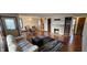 Inviting living space featuring hardwood floors, a cozy fireplace, and a dining area at 543 Schooley Dr, Greenwood, IN 46142