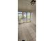 Enclosed porch featuring tiled floors, wood paneling, windows and doors to the outside, and outdoor view at 543 Schooley Dr, Greenwood, IN 46142