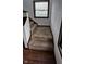 Staircase with carpeted steps and a dark wood handrail at 543 Schooley Dr, Greenwood, IN 46142