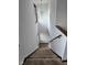 Carpeted stairs leading down with a decorative chandelier at 543 Schooley Dr, Greenwood, IN 46142