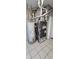 Utility room features tiled floors and a furnace and water heater at 543 Schooley Dr, Greenwood, IN 46142