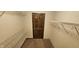 A spacious walk-in closet features wire shelving and a striking dark wood door at 543 Schooley Dr, Greenwood, IN 46142