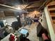 Unfinished basement area with exposed pipes, storage, and potential for customization at 5845 South St, Stilesville, IN 46180