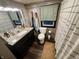 Bathroom featuring a modern vanity, toilet, and a shower with a curtain at 5845 South St, Stilesville, IN 46180