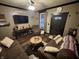 Inviting living room featuring hardwood floors, a ceiling fan, and comfortable furniture at 5845 South St, Stilesville, IN 46180