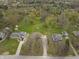 Aerial view of the property showcasing a large lot, mature trees, and convenient access to nearby amenities at 6107 Rural Dr, Indianapolis, IN 46227