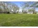 Expansive backyard featuring well-maintained lawn, storage sheds, and plenty of space for outdoor activities at 6107 Rural Dr, Indianapolis, IN 46227