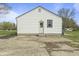 Backyard concrete patio area with siding and door to the house at 6107 Rural Dr, Indianapolis, IN 46227