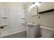 Clean bathroom with tub-shower combination, vanity, and modern fixtures at 6107 Rural Dr, Indianapolis, IN 46227