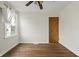 Comfortable bedroom with hardwood floors, window, and built-in closet at 6107 Rural Dr, Indianapolis, IN 46227
