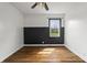 Unique bedroom with two-tone paint, window, ceiling fan and hardwood floors at 6107 Rural Dr, Indianapolis, IN 46227