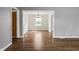 Open dining room with hardwood floors and view of the backyard at 6107 Rural Dr, Indianapolis, IN 46227