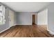 Bright living room features hardwood floors and neutral paint at 6107 Rural Dr, Indianapolis, IN 46227