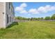 Expansive backyard with healthy green grass and wooden perimeter fence at 621 Fireside Dr, Greenwood, IN 46143