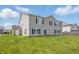 Large backyard of home with vinyl siding, black shutters, and white trim at 621 Fireside Dr, Greenwood, IN 46143