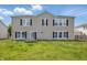 Spacious backyard with swing and ample sunlight shining on the home at 621 Fireside Dr, Greenwood, IN 46143