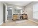 Bathroom featuring tile floors, large mirror, vanity with granite countertop, and natural light at 621 Fireside Dr, Greenwood, IN 46143