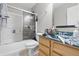 Full bathroom featuring a shower over tub with glass doors, toilet, and vanity at 621 Fireside Dr, Greenwood, IN 46143