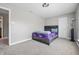 A cozy bedroom space featuring a neutral color scheme, plush carpet, and comfortable, stylish bed at 621 Fireside Dr, Greenwood, IN 46143