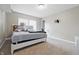 An inviting bedroom with a bright and airy feel, neutral walls, and a bed with plush decor, perfect for rest at 621 Fireside Dr, Greenwood, IN 46143