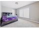 Cozy bedroom with neutral walls, carpet, and a stylish platform bed frame, a comfortable retreat at 621 Fireside Dr, Greenwood, IN 46143