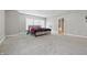 Spacious bedroom featuring carpet, windows for natural light, and fan in corner at 621 Fireside Dr, Greenwood, IN 46143