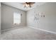 Neutral bedroom with plush carpeting and a bright window to let in light at 621 Fireside Dr, Greenwood, IN 46143