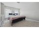 Neutral bedroom with carpet, windows for natural light, and teddy bears on the bed at 621 Fireside Dr, Greenwood, IN 46143