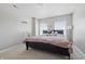 Neutral bedroom with carpet, windows for natural light, and teddy bears on the bed at 621 Fireside Dr, Greenwood, IN 46143