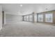 An extra large room with multiple windows and plush carpet, perfect for entertaining and relaxation at 621 Fireside Dr, Greenwood, IN 46143