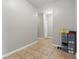 Clean hallway featuring tile flooring and a storage system for shoes and accessories at 621 Fireside Dr, Greenwood, IN 46143