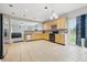 Bright kitchen with wood cabinets, stainless steel appliances, and sliding glass doors at 621 Fireside Dr, Greenwood, IN 46143