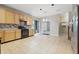 Bright kitchen featuring wood cabinetry, tile floors, and modern appliances at 621 Fireside Dr, Greenwood, IN 46143