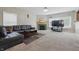 Cozy living room with a fireplace and large black leather couch at 621 Fireside Dr, Greenwood, IN 46143