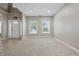 Open-concept living room featuring plush carpeting and abundant natural light at 621 Fireside Dr, Greenwood, IN 46143