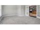 Clean, neutral room with carpet and open French doors to the kitchen at 621 Fireside Dr, Greenwood, IN 46143