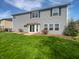 Green backyard featuring a lush lawn and a gray house in the background at 6234 N Woods Edge Dr, McCordsville, IN 46055