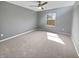 Bright bedroom with neutral carpet, a large window, and fresh paint at 6234 N Woods Edge Dr, McCordsville, IN 46055
